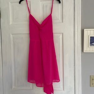 Bright pink mini dress with bows tied in the back
